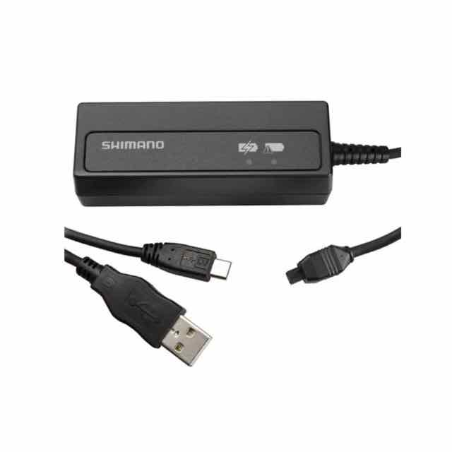 Shimano Di2 internal bike battery charger shown as a black compact unit with USB lead and connector detail on a white background
